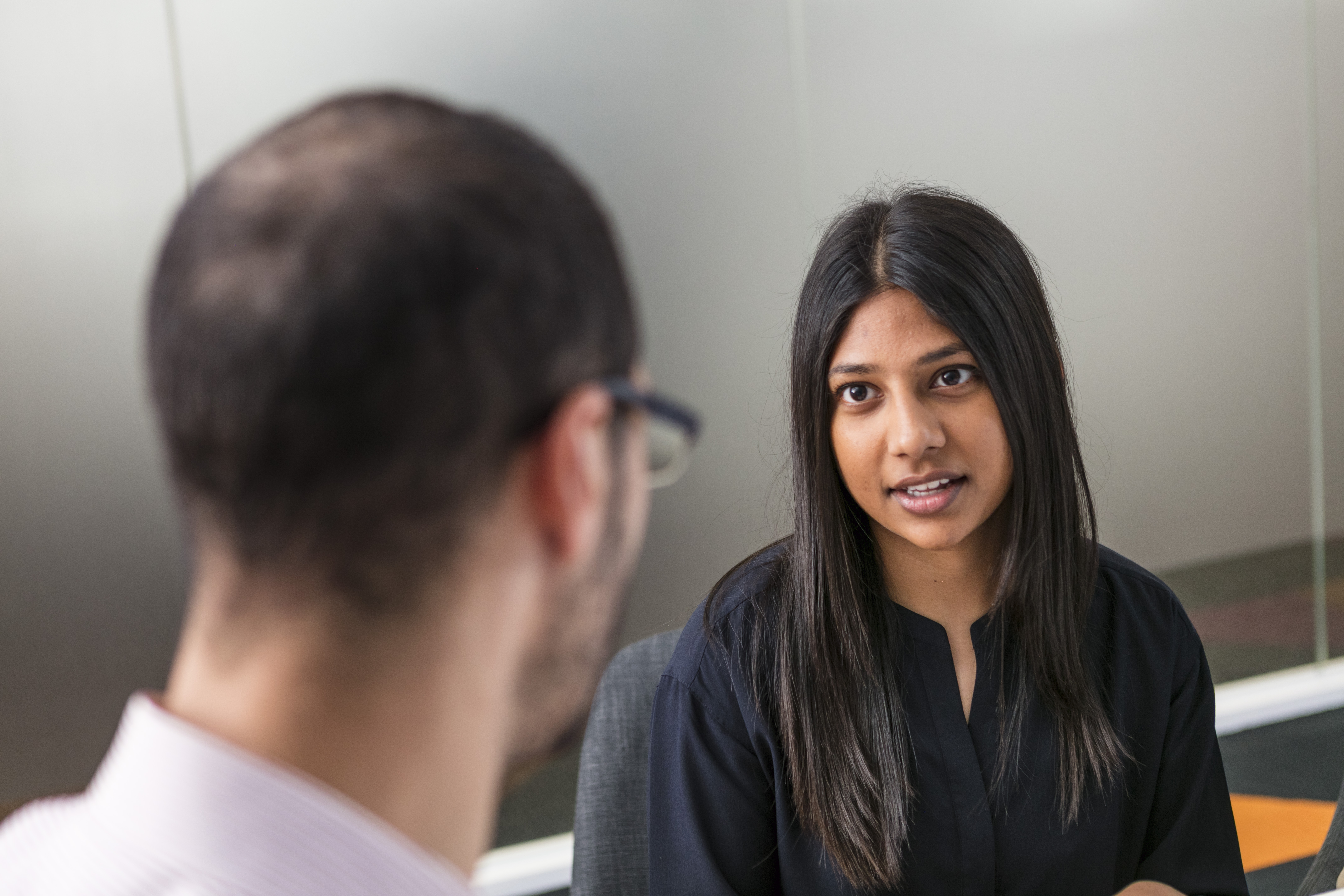 A pre-service educator talking to another educator