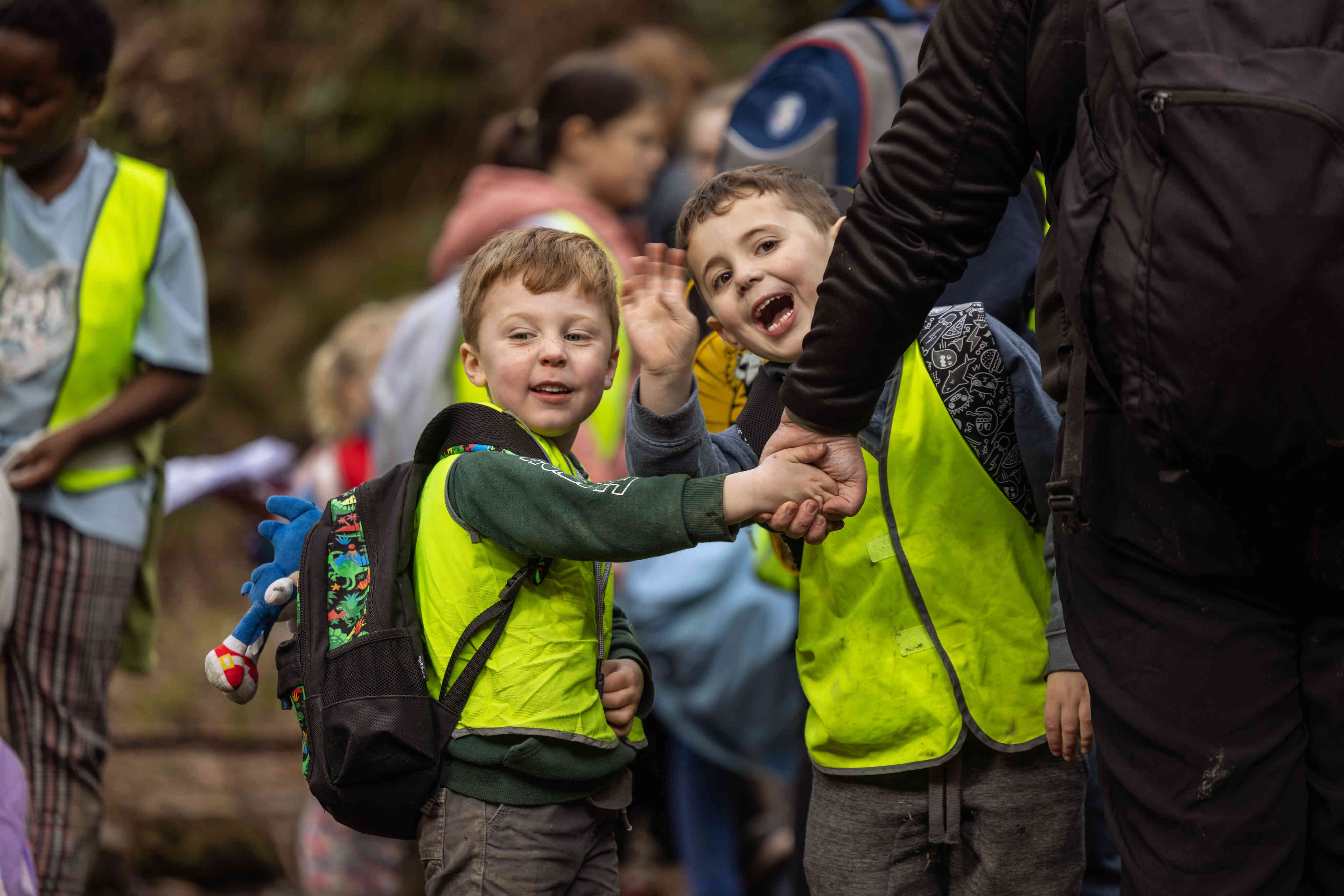 Two boys laugh outside