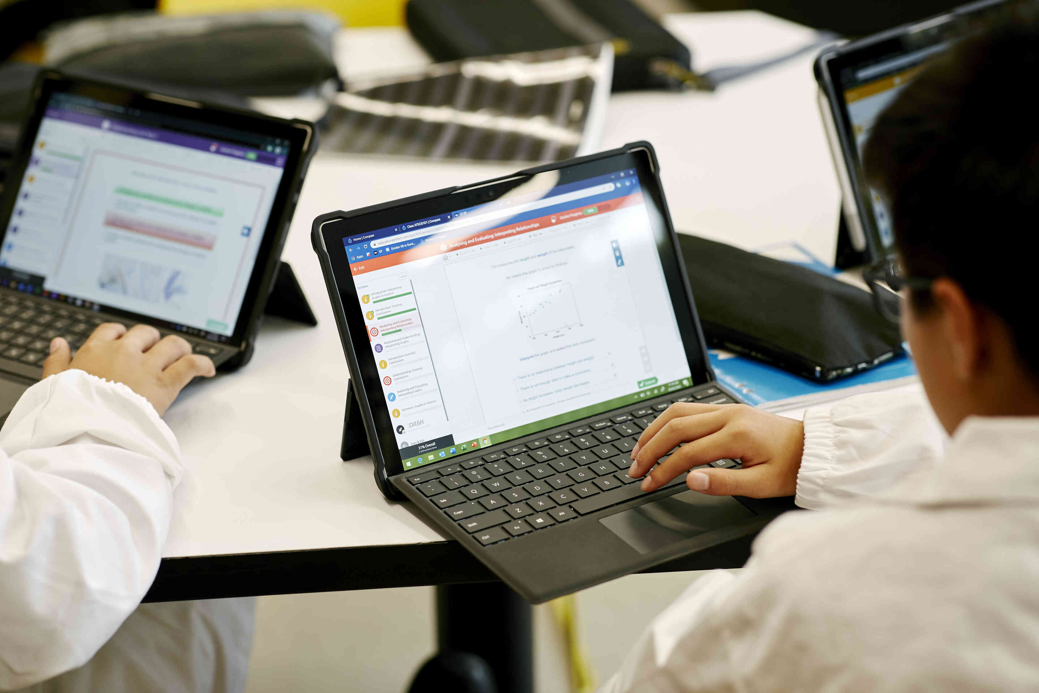 Children read on a computer screen