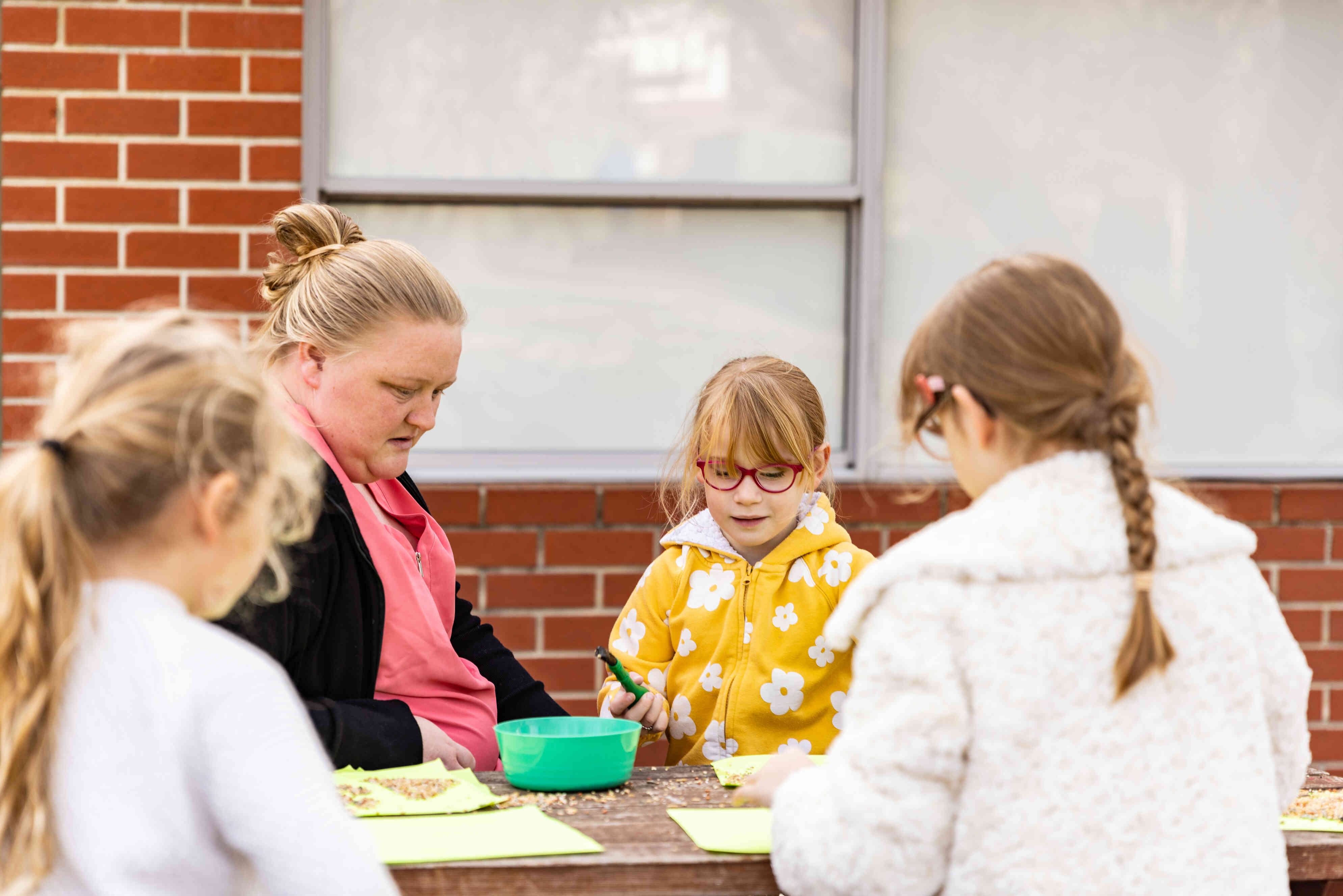 An educator talks to children