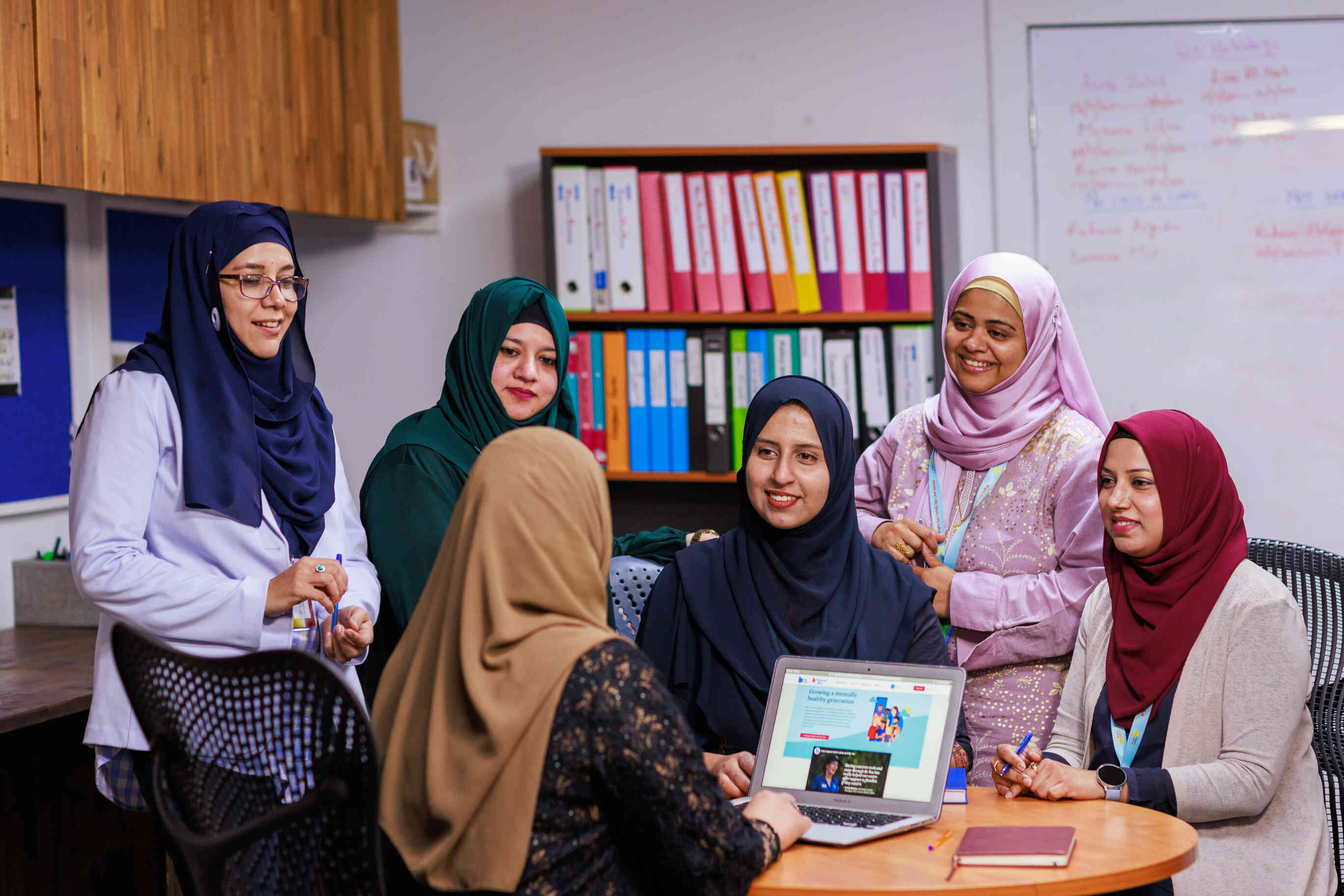 Educators talk around a table