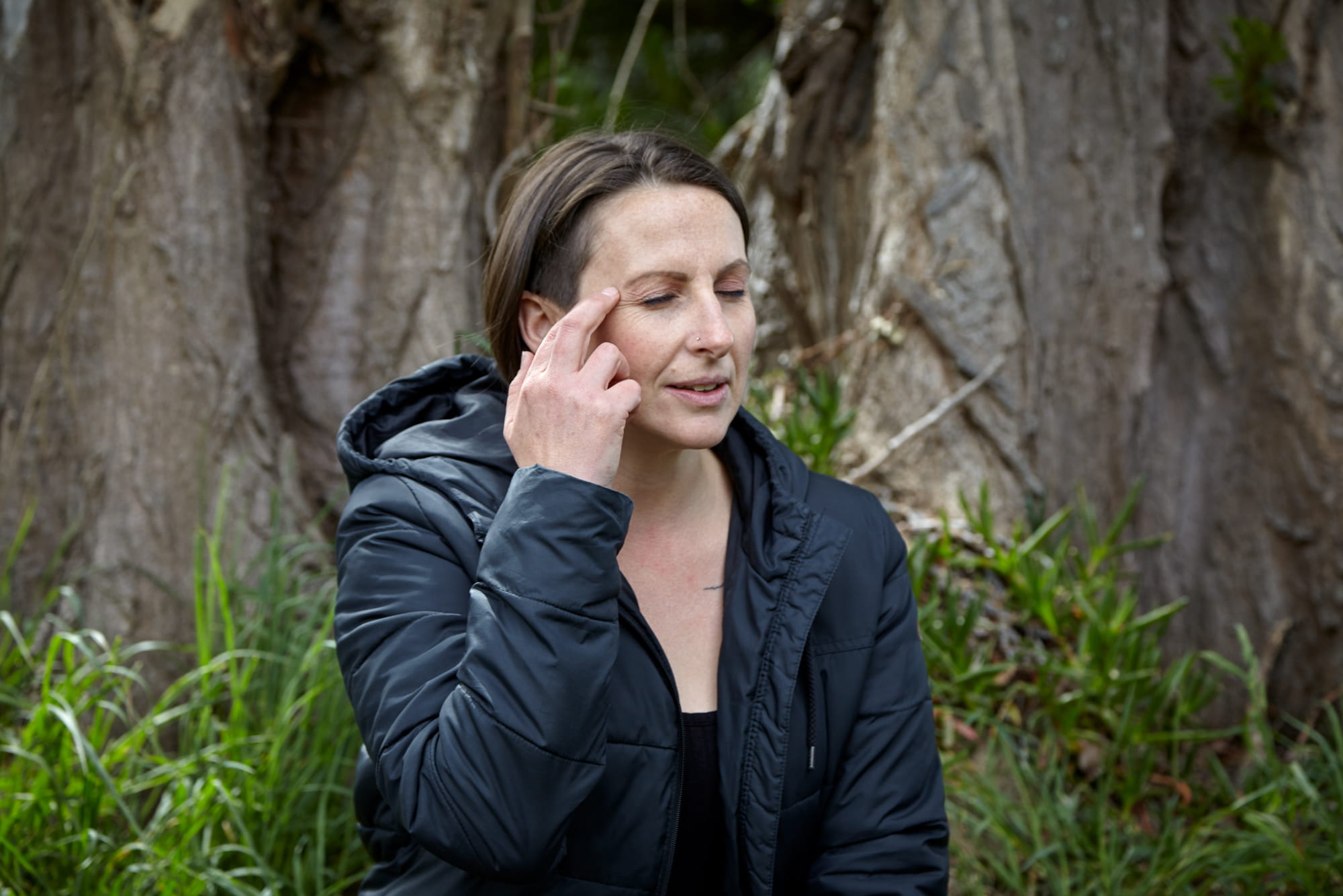 An educator practising mindfulness with their eyes closed